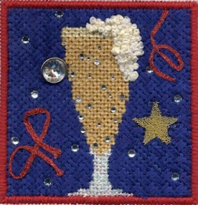 Kathy Schenkel beer glass needlepoint using Kreinik iron-on braid and hot fix crystals along with other embellishments, stitch guide and stitched by neelepoint expert janet m. perrt