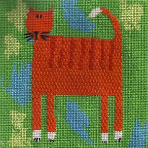 beginning needlepoint canvas of cat. stitched by needlepoint expert janet m. perry