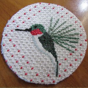 trimmed hummingbird needlepoint on cardboard back