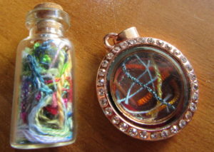 two styles of thread art pendants