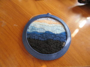 Blue Ridge needlepoint canvas in Planet Earth leather ornament