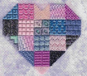 heart needlepoint sampler with sponge painted background