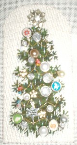 needlepoint christmas tree embellished with beads, buttons, brads, charms and more by needlepoint expert janet m. perry