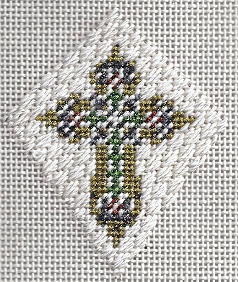 designing women needlepoint cross finished as ornament, stitched by needlepoint expert janet m. perry