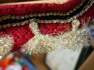 frayed Kreink thread tassel attached to needlepoint