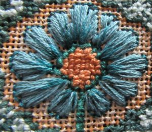 Arts & Crafts flower needlepoint close-up