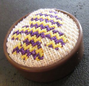 Clover pincushion with needlepoint top,