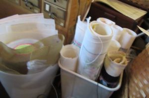 use clean wastepaper baskets to store rolled needlepoint canvas