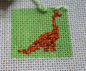 needlepoint dinosaur square