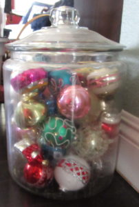 glass jar with vintage ornaments