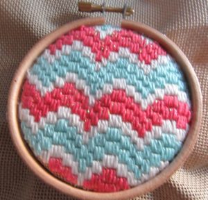 needlepoint finished on hoop from front