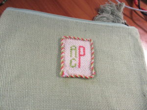 cosmetic bag with needlepoint patch